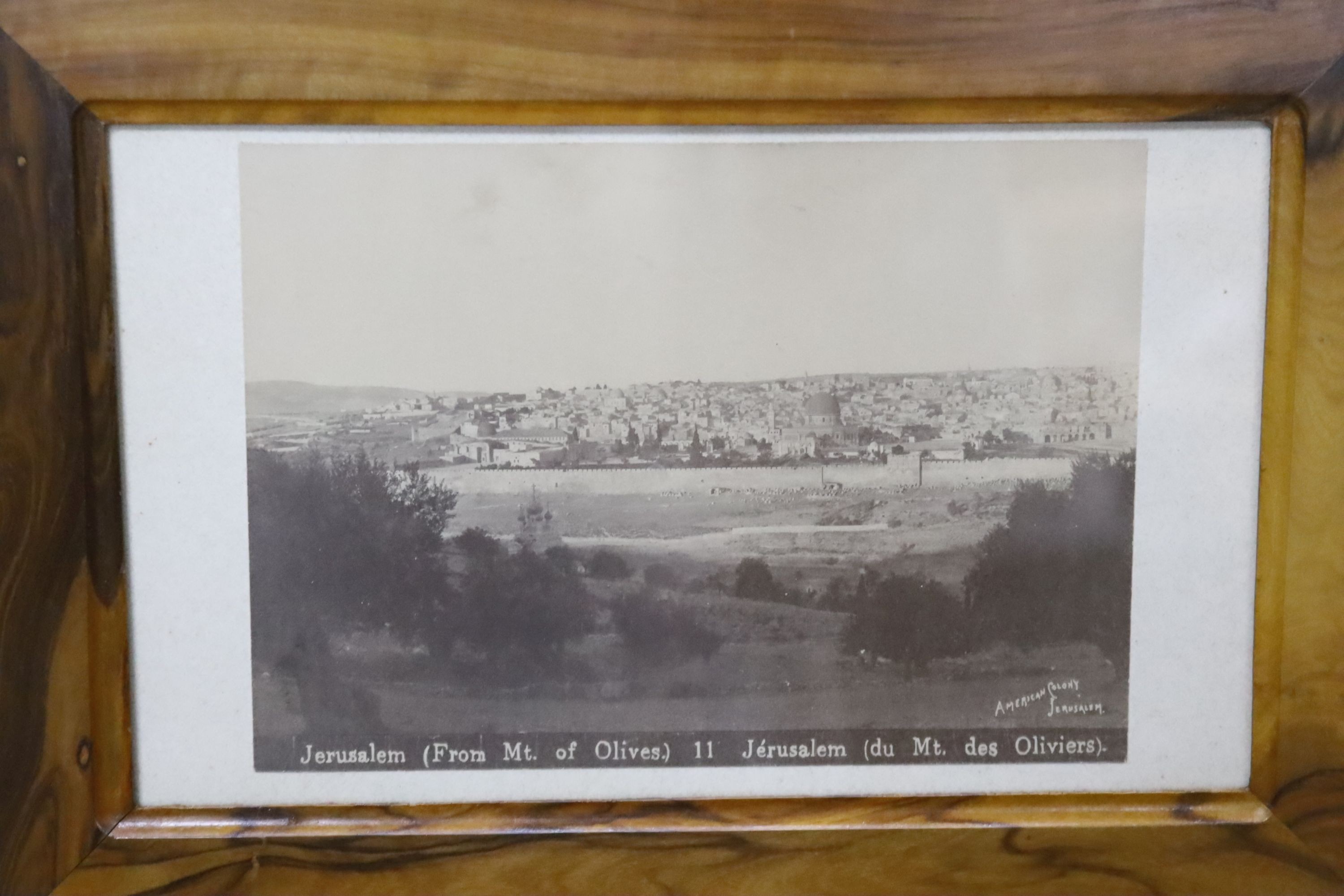 A Jerusalem olivewood casket, bombe shape with inset photograph, width 34cm